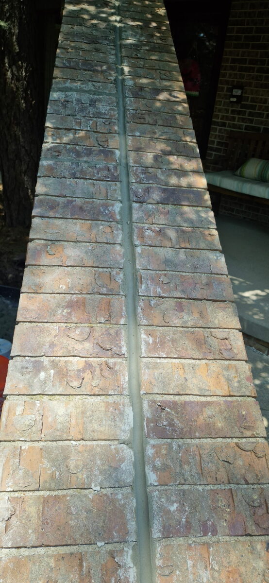 Glazed antique brick pier with fresh mortar joints in Omaha