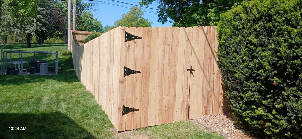 Finished cedar privacy fence with double gate in Omaha