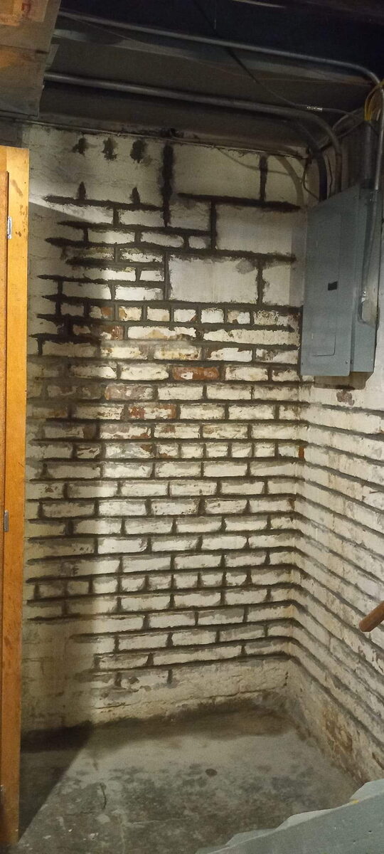 Repointed basement brick foundation wall in Omaha after repair